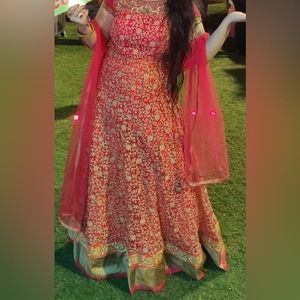 Red & orange gown with golden work.